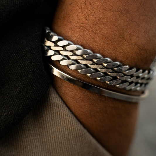 Men’s sterling silver curb chain bracelet stacked with minimalist bangle, modern luxury wrist styling – AEXON SMITH
