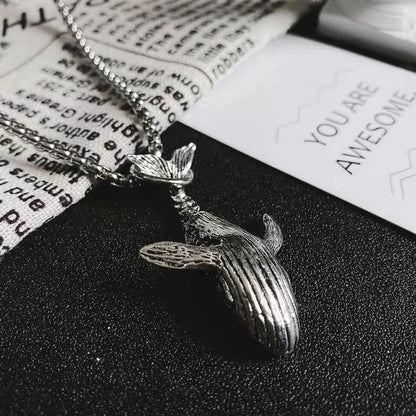 Minimalist whale pendant necklace inspired by the 52Hz whale