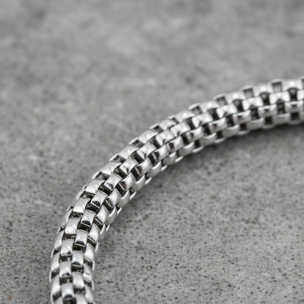 Close up of a 925 sterling silver chain bracelet woven mesh design
