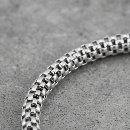 Close up of a 925 sterling silver chain bracelet woven mesh design