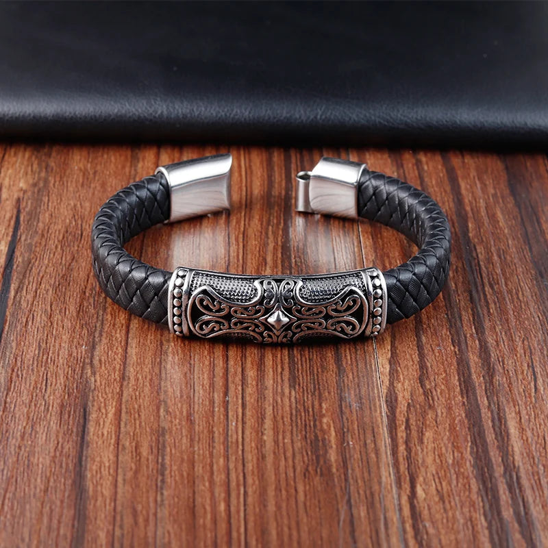 black braided leather bracelet with silver cross detail