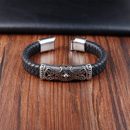 black braided leather bracelet with silver cross detail