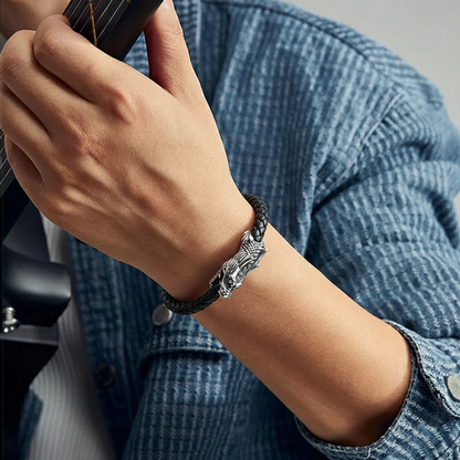 black leather bracelet with detailed dragon design for men on wrist
