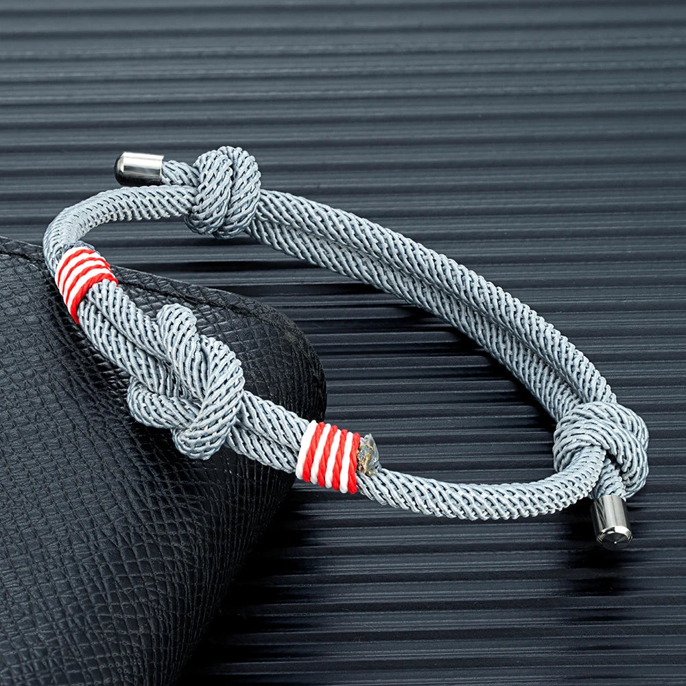 grey braided rope bracelet with central love knot