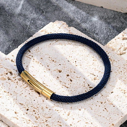 dark blue cord bracelet with gold plated stainless steel clasp