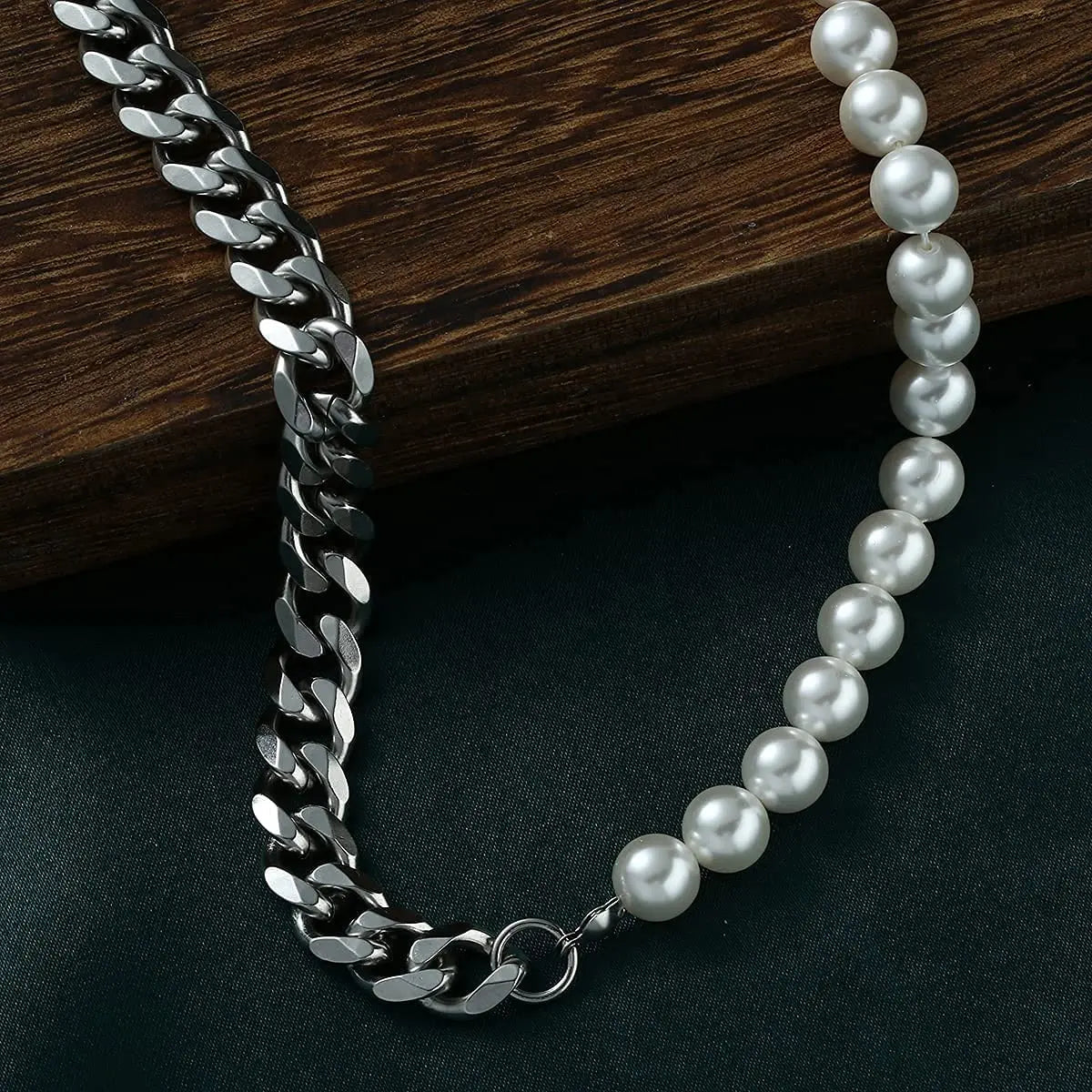 Close up of men’s pearl bead and Cuban link chain necklace
