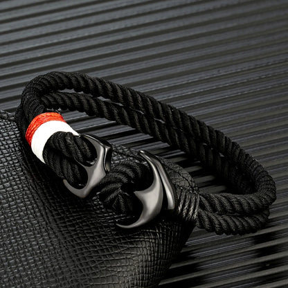 Men’s nautical anchor rope bracelet with black double strand marine cord and stainless steel anchor clasp.