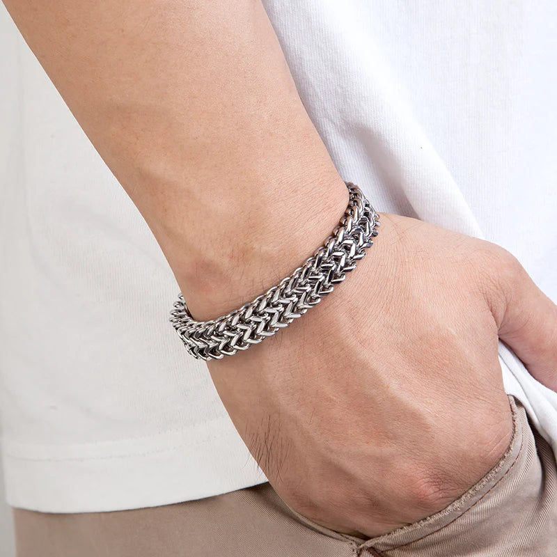men's heavy cuban link chain bracelet on a wrist
