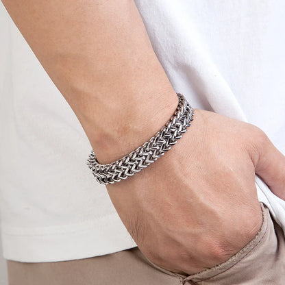 men's heavy cuban link chain bracelet on a wrist