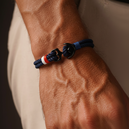 Men wearing nautical anchor rope bracelet on wrist with navy cord and black anchor clasp