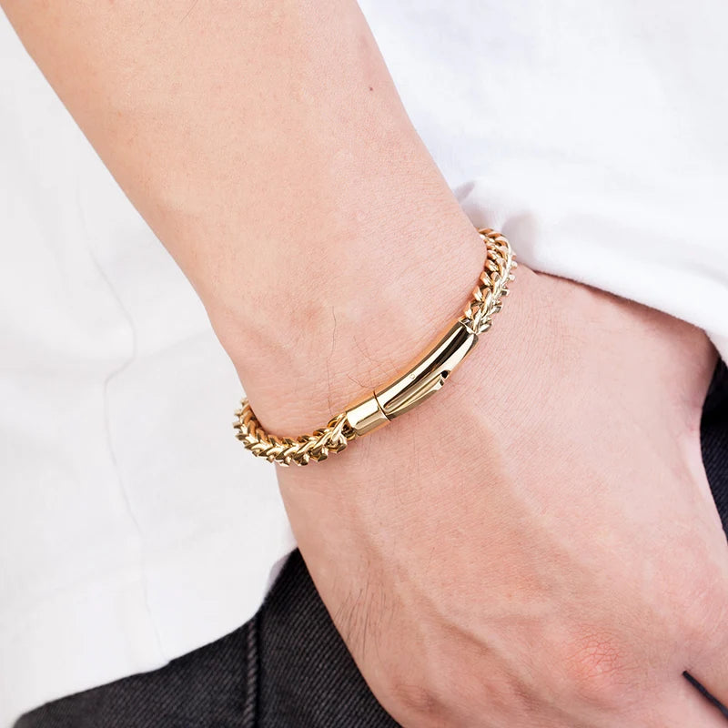 men's gold street style stainless steel chain bracelet on a wrist