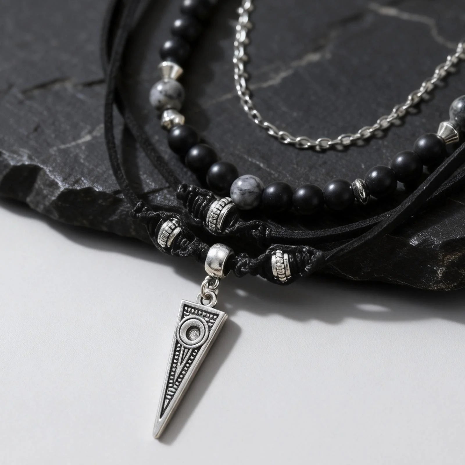 Close up of men’s layered chain necklace set