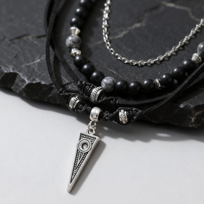 Close up of men’s layered chain necklace set