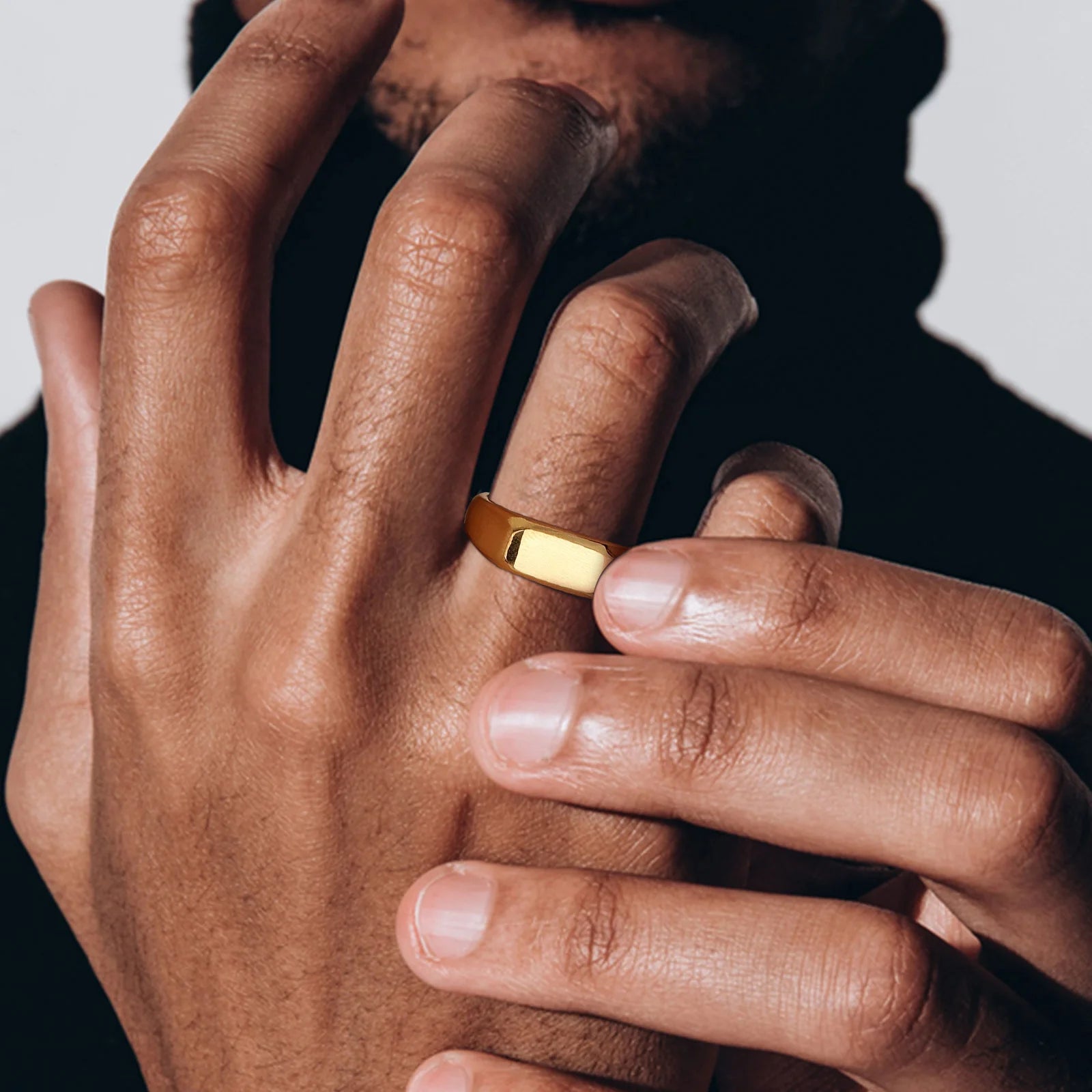 Minimalist men’s stainless steel gold signet ring band close up