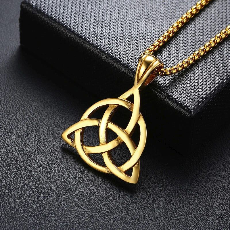 Gold trinity knot charm necklace representing unity and eternity