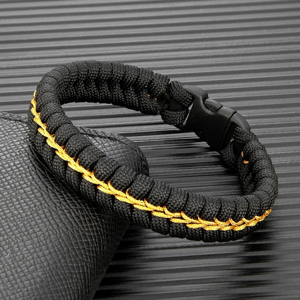 outdoor survival paracord bracelet with black and gold braided cord
