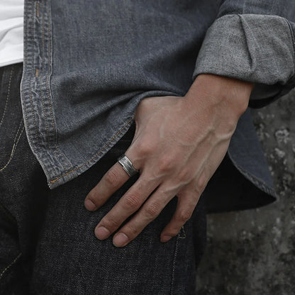 Rustic stainless steel ring with engraved texture pattern