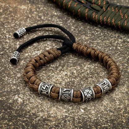 Viking runic bracelet with adjustable paracord and rune beads.