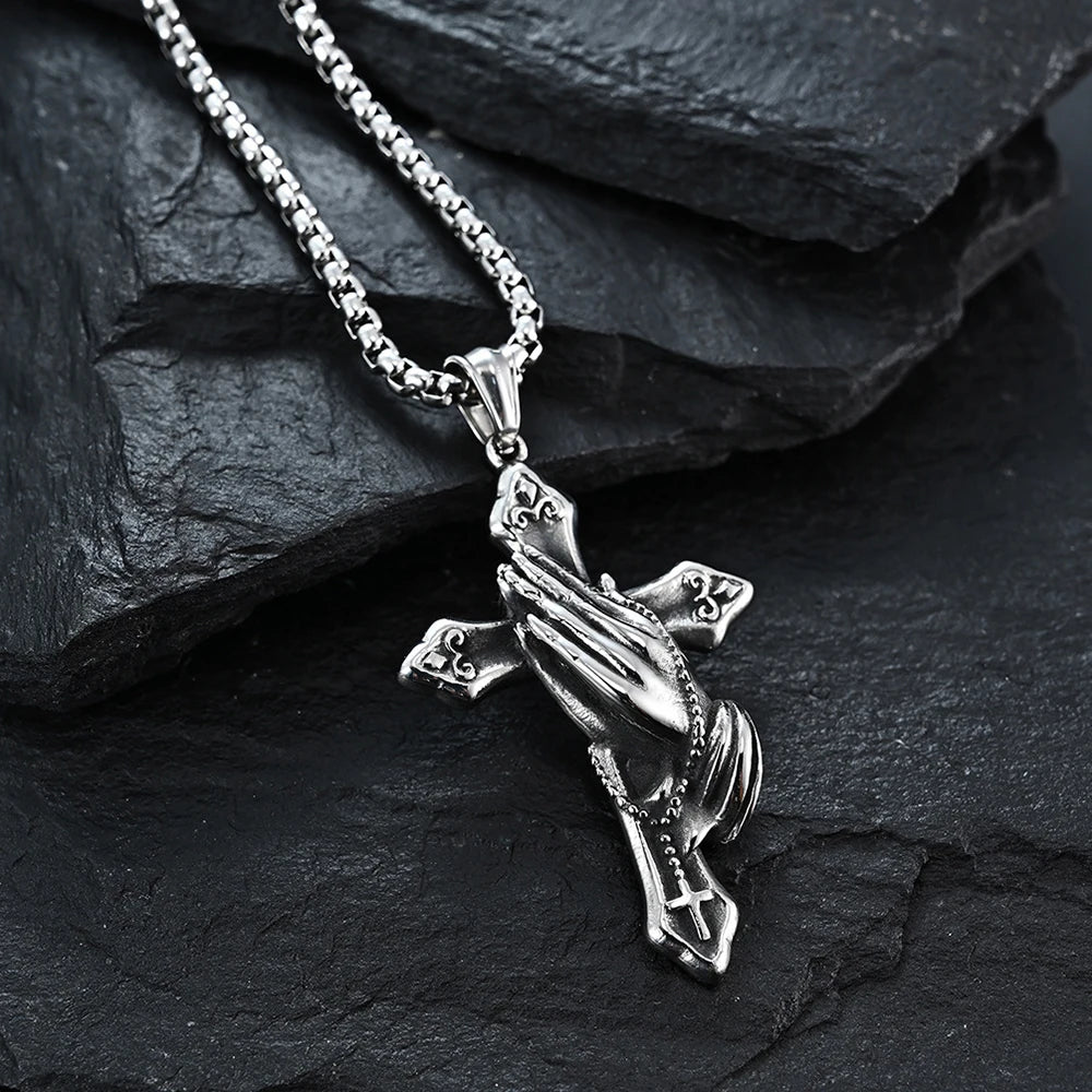Vintage Christian cross necklace featuring praying hands design