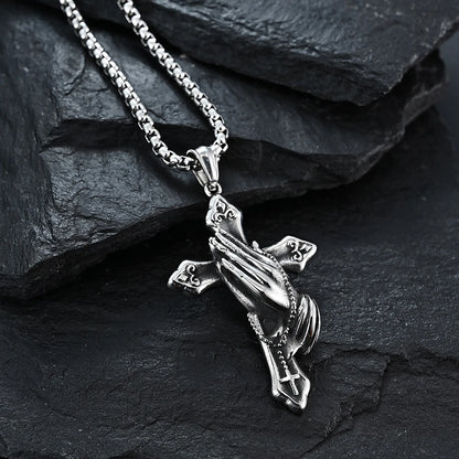 Vintage Christian cross necklace featuring praying hands design